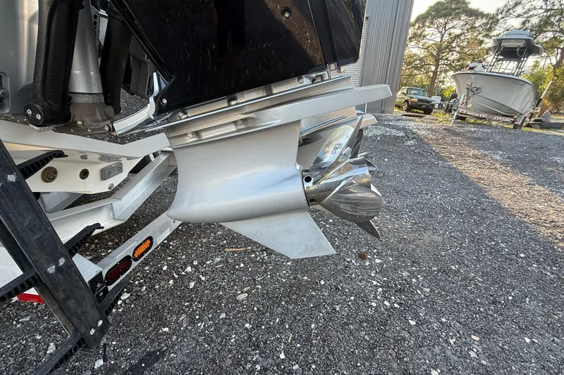 Slide: The Image of 2024 Nor-Tech 400 Supersport boat propeller and engine detail on trailer. - 39