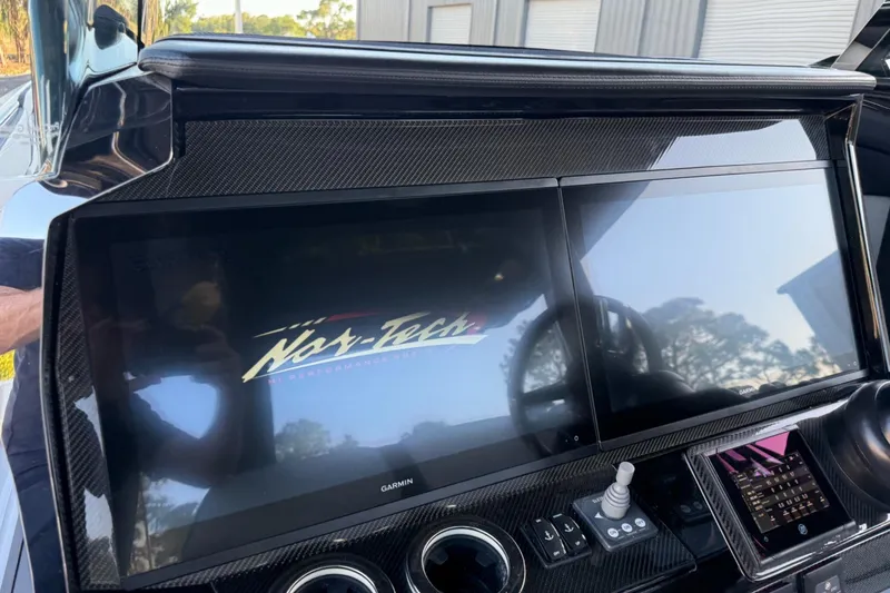 Slide: The Image of 2024 Nor-Tech 400 Supersport dashboard with dual screens and advanced controls. - 40