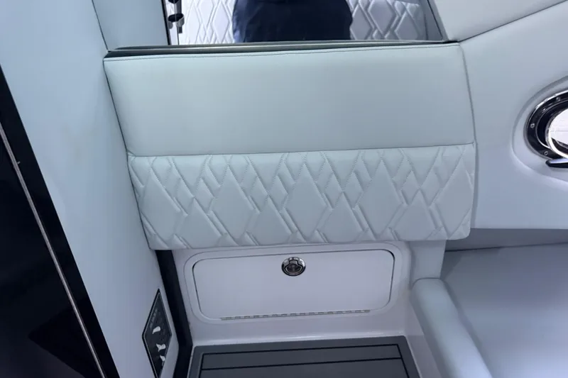 Slide: The Image of 2024 Nor-Tech 400 Supersport interior with quilted upholstery and sleek storage compartment. - 47
