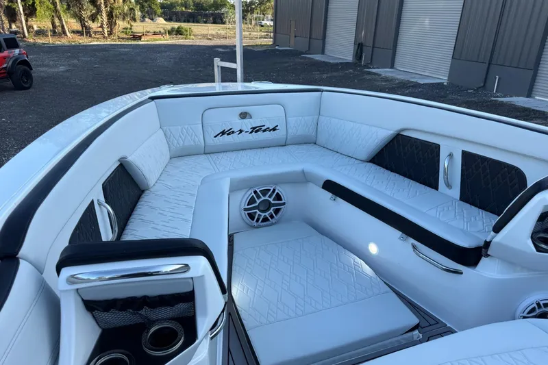 Slide: The Image of Luxurious seating area of 2024 Nor-Tech 400 Supersport boat with elegant white upholstery. - 49