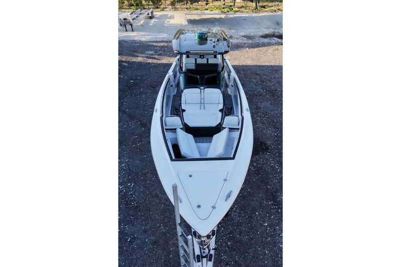Slide: The Image of 2024 Nor-Tech 400 Supersport boat, aerial view showcasing sleek design and luxurious seating. - 5