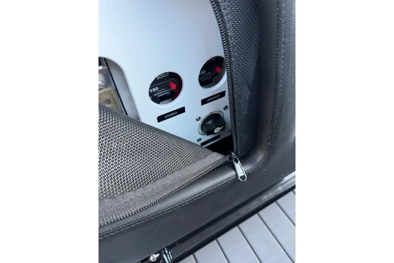 Slide: The Image of 2024 Nor-Tech 400 Supersport control panel with stereo and anchor switches. - 56