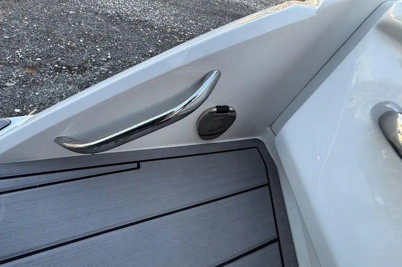 Slide: The Image of 2024 Nor-Tech 400 Supersport boat deck with sleek chrome handle and modern design. - 57
