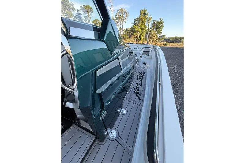Slide: The Image of 2024 Nor-Tech 400 Supersport boat deck with sleek design and modern features. - 58