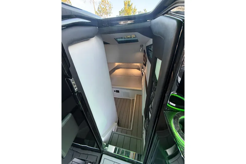 Slide: The Image of Interior cabin of 2024 Nor-Tech 400 Supersport boat, featuring sleek design and modern amenities. - 59