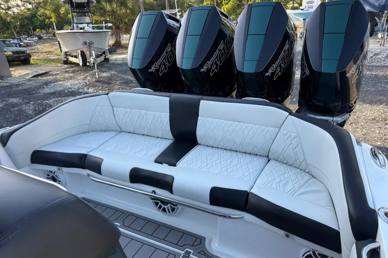 Slide: The Image of 2024 Nor-Tech 400 Supersport boat with luxurious seating and powerful engines. - 61