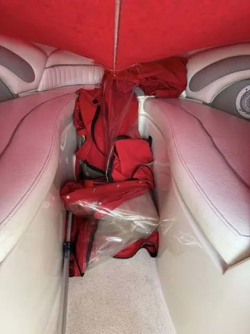 Slide: The Image of Interior of a 2007 Stingray 250 LR boat with red upholstery. - 10
