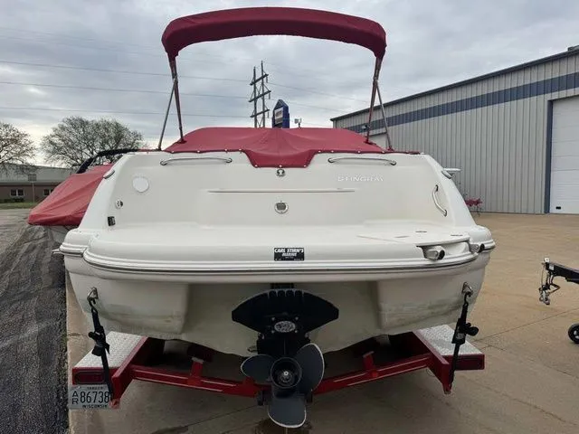 Slide: The Image of 2007 Stingray 250 LR boat with red canopy on trailer. - 3