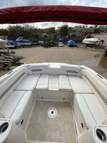 Slide: The Image of Interior of a 2007 Stingray 250 LR boat with white seating. - 6