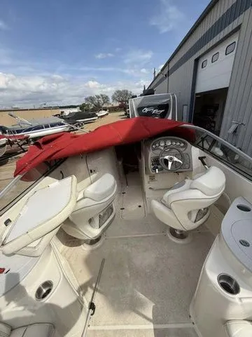 Slide: The Image of 2007 Stingray 250 LR boat with red cover and white interior. - 7
