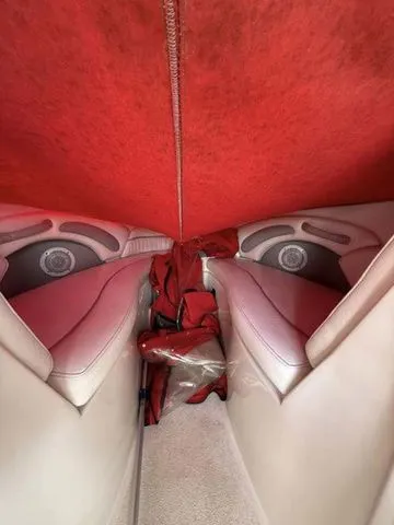 Slide: The Image of Interior of a 2007 Stingray 250 LR boat with red upholstery. - 9