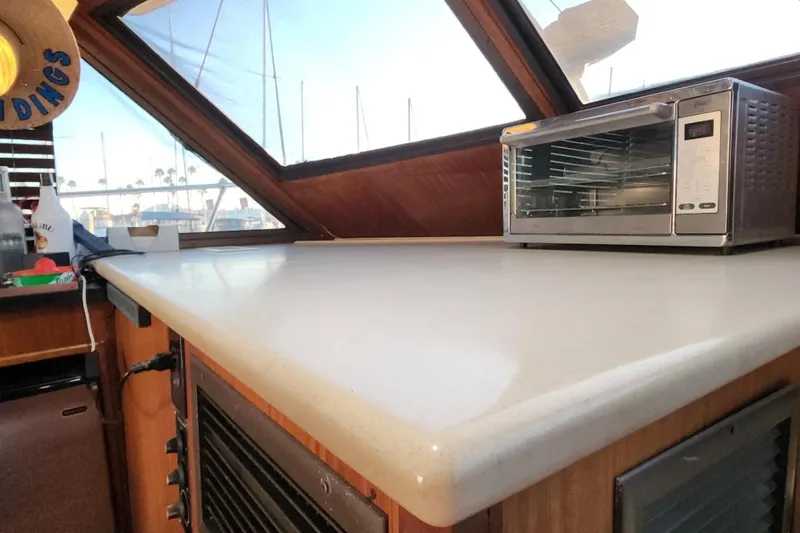 Slide: The Image of Interior of 1978 Hatteras 45 Express Sportfish with countertop and toaster oven. - 10