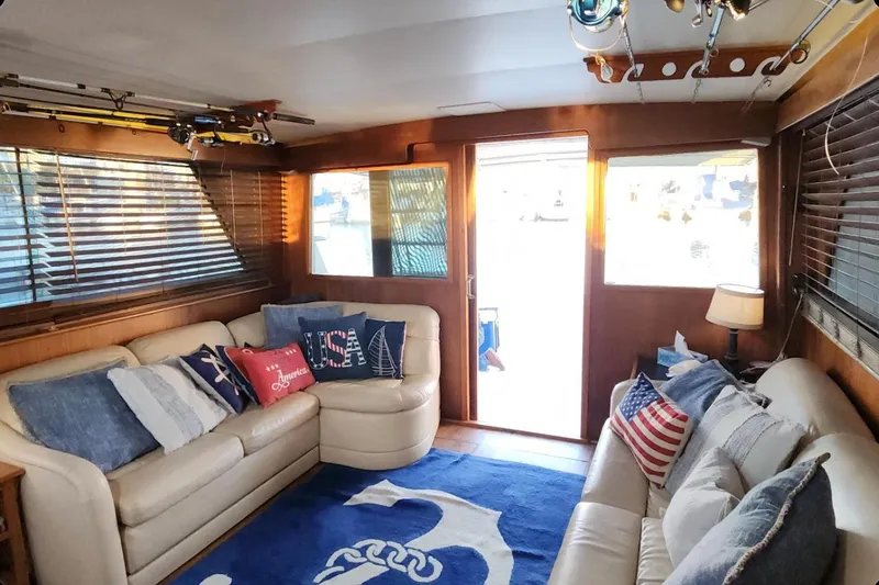 Slide: The Image of Interior of 1978 Hatteras 45 Express Sportfish with nautical decor and cozy seating. - 2