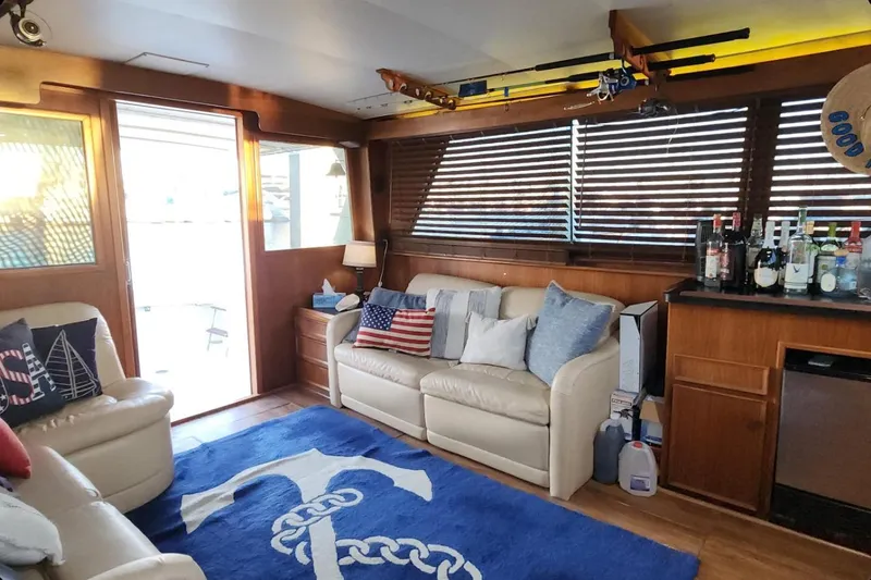 Slide: The Image of Interior of 1978 Hatteras 45 Express Sportfish with nautical decor and bar setup. - 22