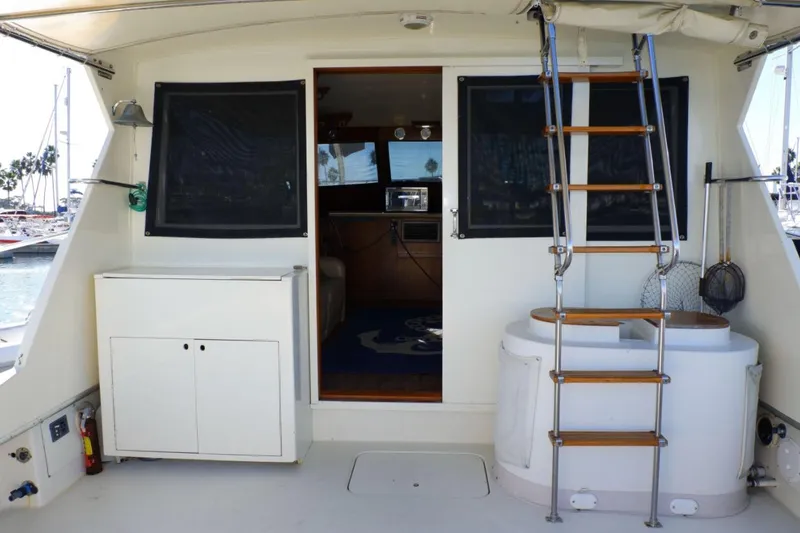 Slide: The Image of 1978 Hatteras 45 Express Sportfish boat interior with ladder and storage cabinet. - 4
