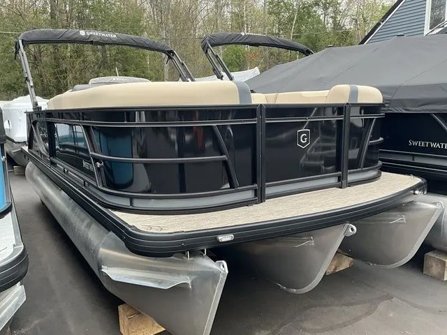 The Image of Godfrey Sweetwater 2086 C Sport Tube 2026 pontoon boat, black, in storage. - 1