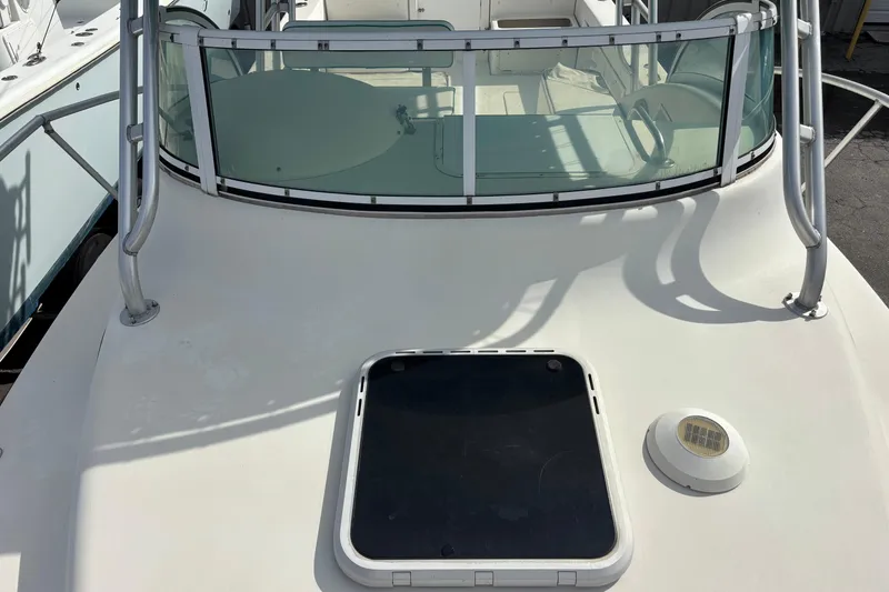Slide: The Image of 1998 Hydrocat 300X boat deck with windshield and hatch, showcasing sleek design. - 15
