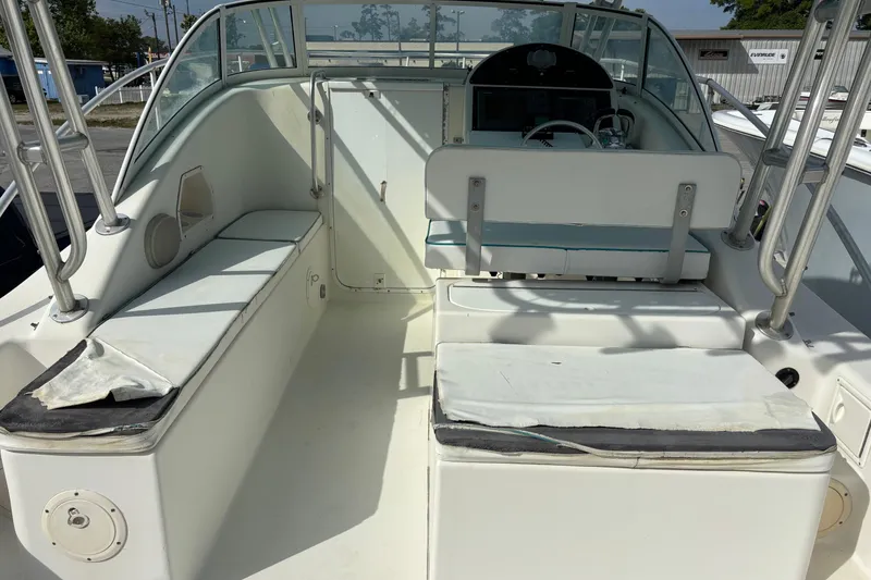 Slide: The Image of 1998 Hydrocat 300X boat interior with seating and steering console. - 18