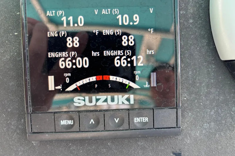 Slide: The Image of Suzuki engine display showing 66 engine hours and 88°F temperature on Hydrocat 300X, 1998 model. - 7