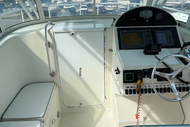 Slide: The Image of Interior view of a 1998 Hydrocat 300X boat cockpit with navigation equipment. - 9