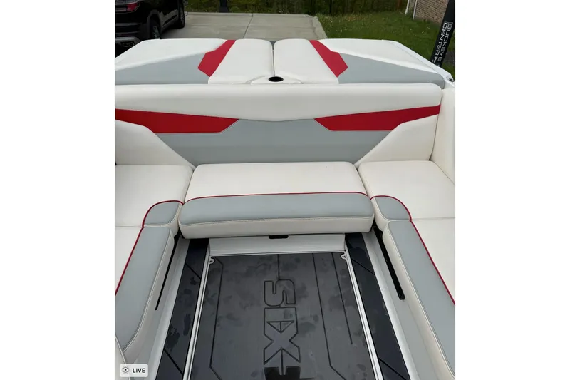 Slide: The Image of Interior of 2020 Axis A20 boat with white, gray, and red seating. - 4