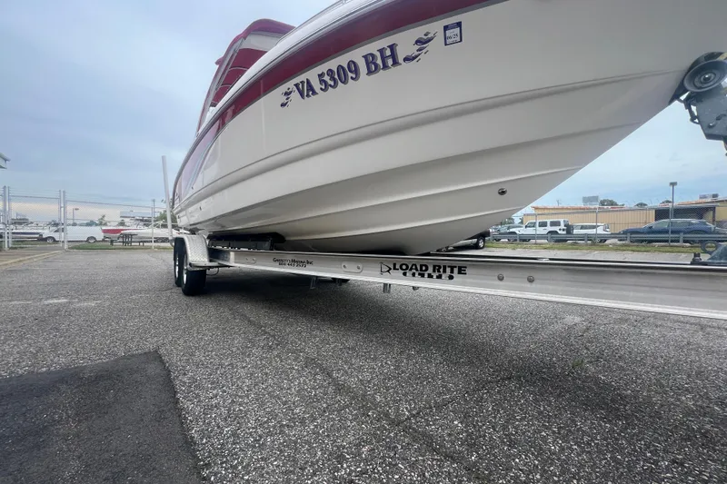 Slide: The Image of 2006 Chaparral 256 SSi boat on Load Rite trailer in parking lot. - 13