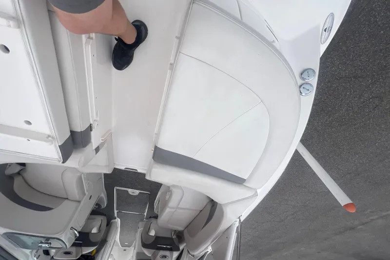 Slide: The Image of 2006 Chaparral 256 SSi boat interior with white seating and gray accents. - 16
