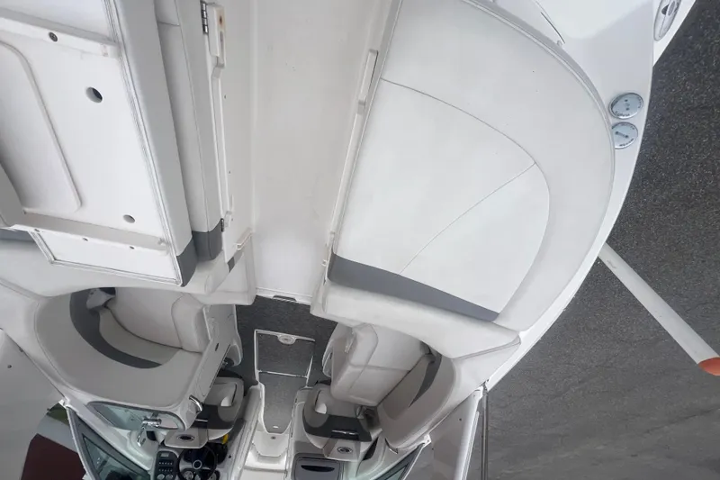 Slide: The Image of 2006 Chaparral 256 SSi boat interior with seating and dashboard view. - 17