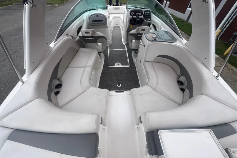 Slide: The Image of 2006 Chaparral 256 SSi boat interior with spacious seating and modern dashboard. - 18