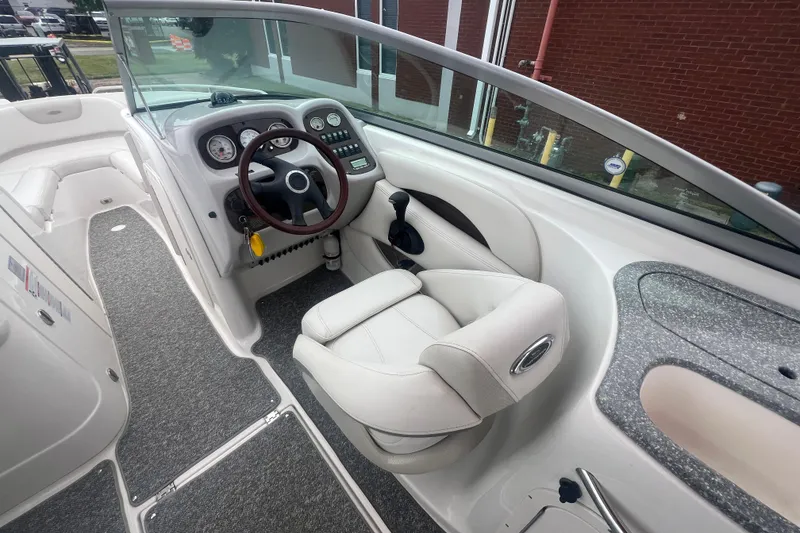 Slide: The Image of 2006 Chaparral 256 SSi boat interior with steering wheel and dashboard controls. - 20