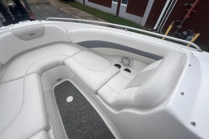 Slide: The Image of 2006 Chaparral 256 SSi boat interior with white seating and gray accents. - 24