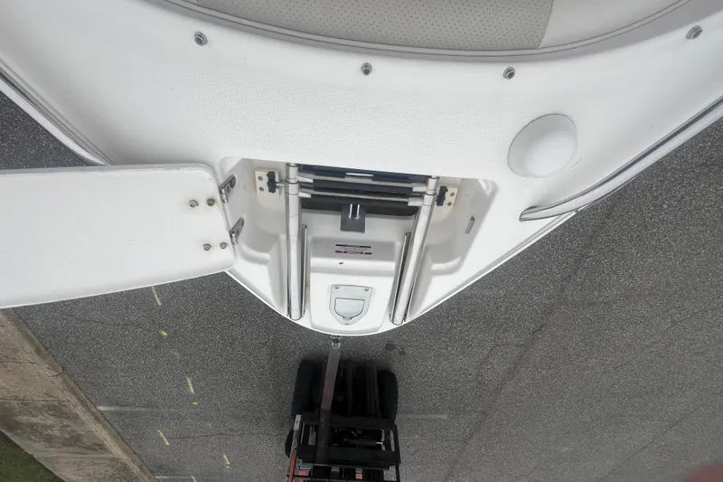 Slide: The Image of 2006 Chaparral 256 SSi boat bow with ladder and hatch, viewed from above. - 26