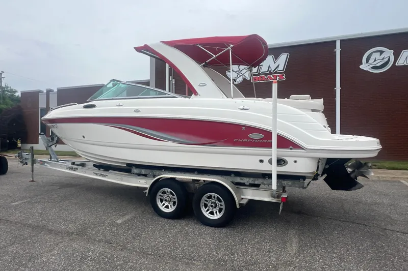 Slide: The Image of 2006 Chaparral 256 SSi boat with red and white design on a trailer. - 3