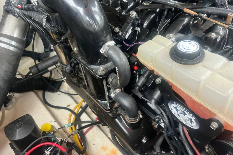 Slide: The Image of Engine compartment of a 2006 Chaparral 256 SSi boat, showing hoses and components. - 40