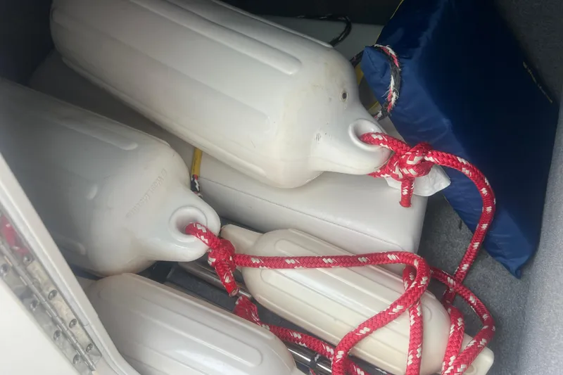 Slide: The Image of Boat fenders with red ropes in a Chaparral 256 SSi, 2006 model. - 42