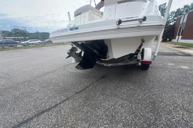 Slide: The Image of Rear view of a 2006 Chaparral 256 SSi boat on a trailer. - 6