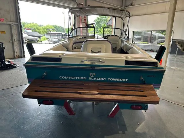 Slide: The Image of 1995 Tigé 2002 FSLM Comp slalom competition towboat in warehouse. - 6