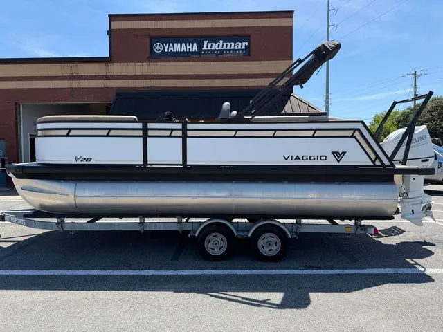 The Image of Viaggio Lago V20U 2026 pontoon boat in front of Yamaha Indmar building. - 1