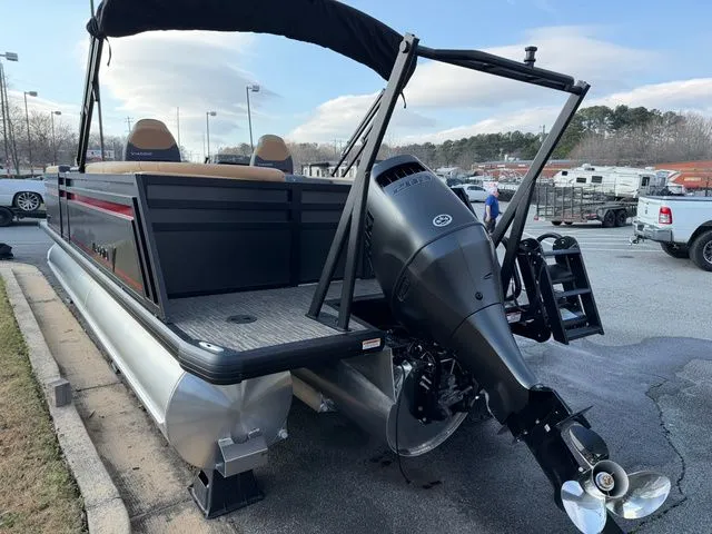 Slide: The Image of Viaggio x22u 2026 pontoon boat with outboard motor in parking lot. - 4