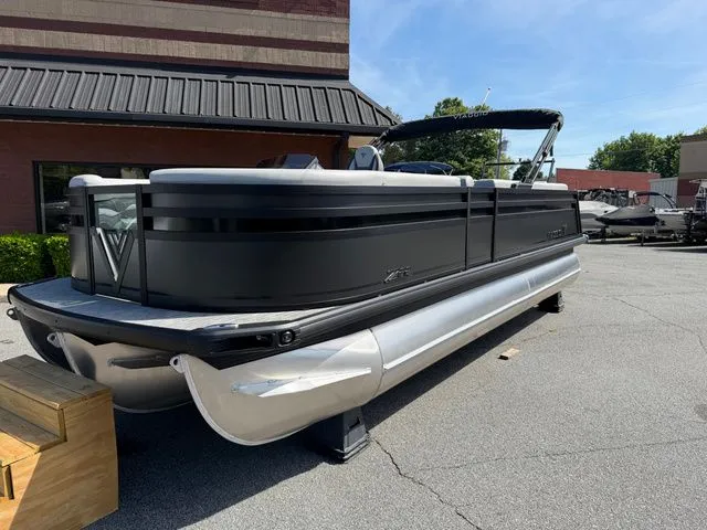 Slide: The Image of Viaggio Lago Z22B 2026 pontoon boat parked outdoors. - 13