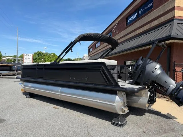Slide: The Image of Viaggio Lago Z22B 2026 pontoon boat parked outside a building. - 14