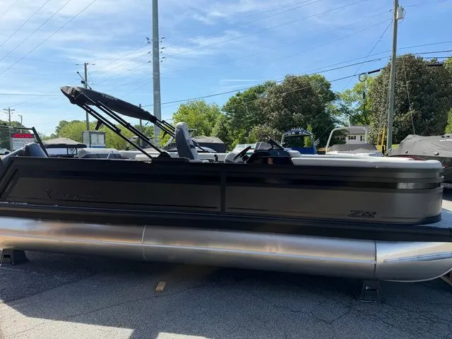 Slide: The Image of Viaggio Lago Z22B 2026 pontoon boat parked in daylight. - 17