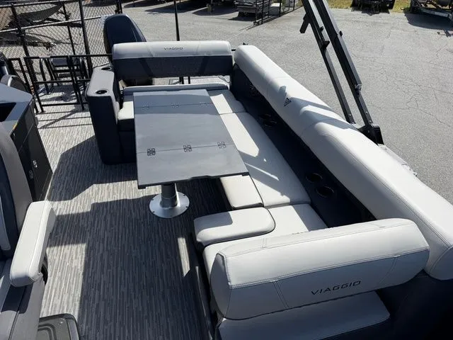 Slide: The Image of Viaggio Lago Z22B 2026 pontoon boat with gray seating and table. - 4