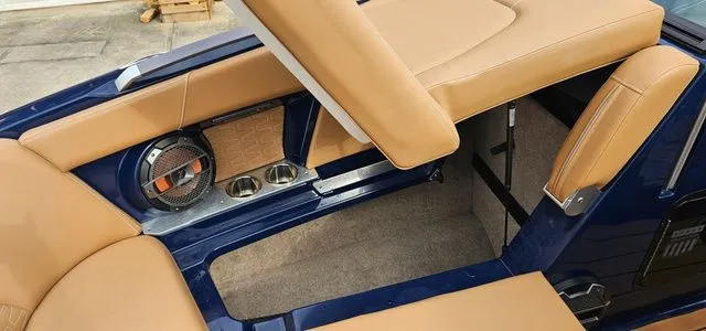 Slide: The Image of Interior of a 2020 MasterCraft X24 boat with brown seating. - 15
