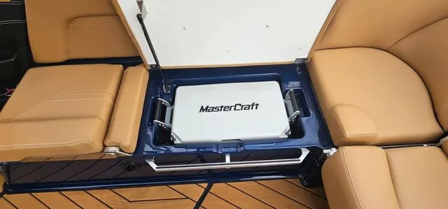 Slide: The Image of 2020 MasterCraft X24 boat with storage and seating area. - 18