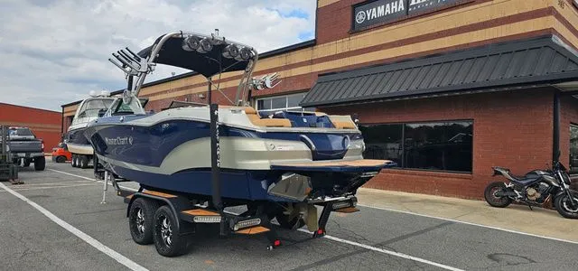 Slide: The Image of 2020 MasterCraft X24 boat parked outside Yamaha store. - 3