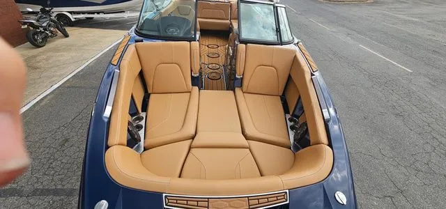 Slide: The Image of Interior of a 2020 MasterCraft X24 boat with luxurious leather seating. - 8