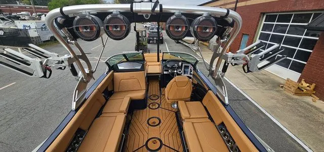 Slide: The Image of Interior view of a 2020 MasterCraft X24 boat with luxurious features. - 9