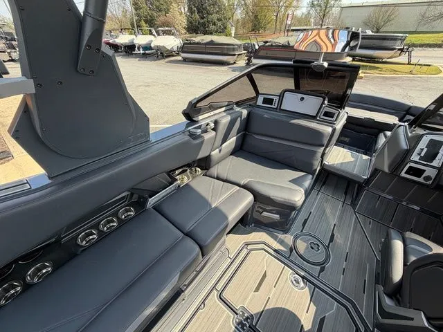 Slide: The Image of Interior of a 2023 Supra SL550 boat with luxurious seating. - 14