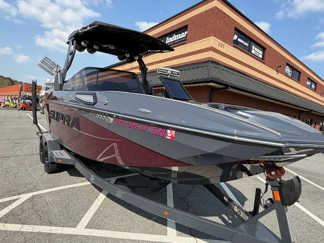 Slide: The Image of 2023 Supra SL550 boat parked in front of a store. - 17